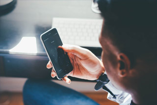 Person looking at a phone held in front of their face